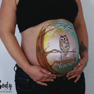 Body schmink studio bellypaint uil realistic with cherry blossom foto belly side logo
